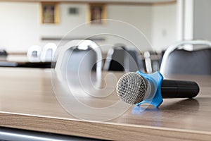 Close up microphone on table in seminar room