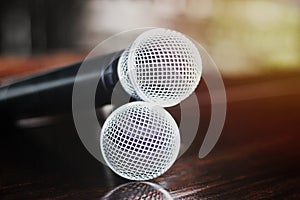 Close up Microphone voice speaker on dark background. radio microphones. wireless sound transmission system. soft focus Two mics C photo