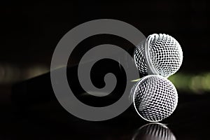 Close up Microphone voice speaker on dark background. radio microphones. wireless sound transmission system. soft focus Two mics C