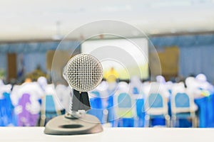 Close up microphone wireless Stand on white table in business conference interior seminar meeting room