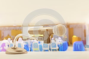 Close up microphone wireless Stand on white table in business conference interior seminar meeting room