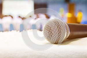 Close up microphone wireless on the white table in business conference interior seminar meeting room