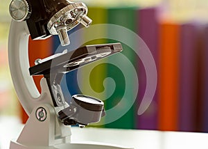 Close up Microscope on table with laboratory equipment in chemical lab