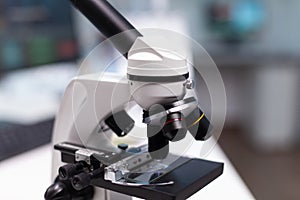 Close up of microscope with transparent tray in science laboratory