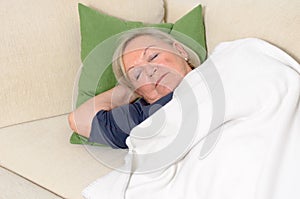 Close up Middle Aged Blond Woman Resting on Couch