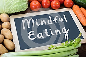 Close-up Of Mindful Eating Text On Slate