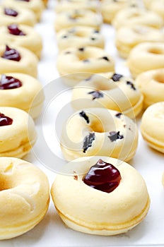 Close up of mini donut dessert homemade bakery for food backgrounds concept, vertical side