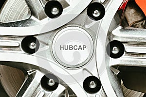 Close up a mini hubcap cover of car wheel, hubcap cover in a wheel hub.