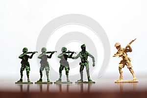 Close-up of miniature a group of plastic toys soldiers at war.