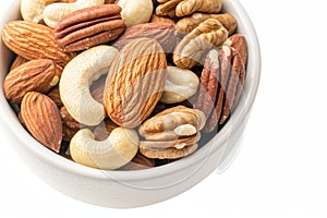 Close-up of mixed nuts in a white bowl