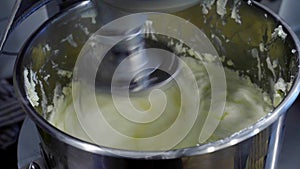 close-up of a mixer for whipping buttercream and dough for baking. homemade recipes.