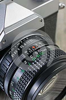 Close up of a 35mm analog camera manual focus lens