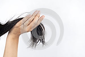 Close up of a mobile phone dealing with dry and damaged hair