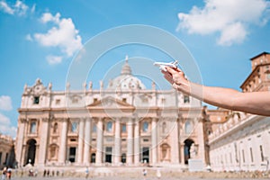 Close up model plane in Vatican city and St. Peter`s Basilica church, Rome, Italy.