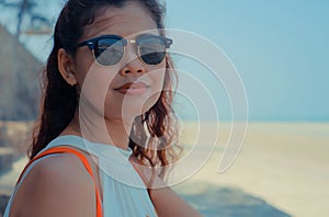 Close up of model on sunlit Thailand beach.