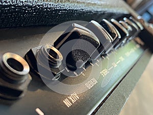 Close-up modern amplifier with black knob and control panel. clean and hi-gain distortion.