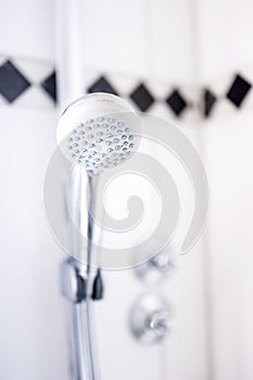 close up of modern bathroom shower head at hotel