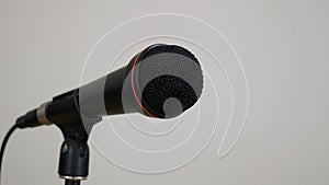 Close-Up of a Modern Black Microphone on a Stand