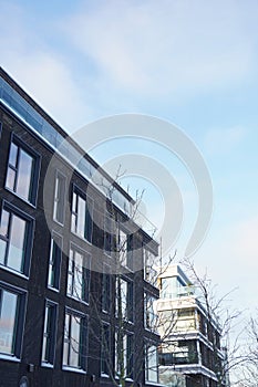 Close up of modern building towards blue sky. Kalamaja, Tallinn, Estonia, Europe. January 2024