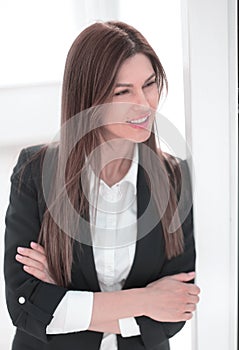 Close up.modern business woman looking through office window.