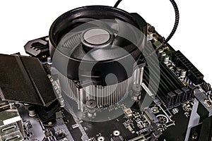 Close-up of modern computer motherboard with installed cpu and cooler. Electronic computer hardware technology
