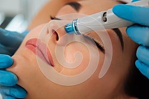 Close up of a modern device for hydrafacial procedure