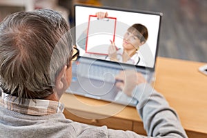 Close up of modern elderly man having online consultation with doctor