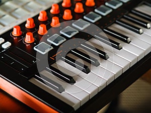 Close-up. Modern electronic musical instrument - midi keyboard. Professional equipment for a recording studio. There are no people