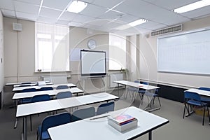 close-up of modern empty classroom with interactive whiteboard and tablets