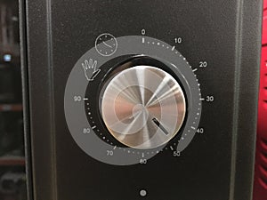 Close up of modern microwave control panel, knob and modes