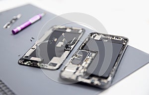 Close up of modern mobile phone repair process chip. Service for restoration and maintenance of smartphones