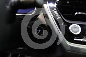 Close up of modern new car start,stop engine button.