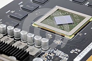 Close up modern printed circuit Board with Advanced Graphic Processing Unit. Electronic Devices Production