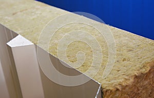 A close-up of a modern roofing insulation building material, roofing sandwich panel with a mineral wool core, fireproof mineral