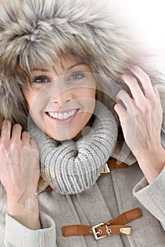 Close-up of modern woman in fur hood