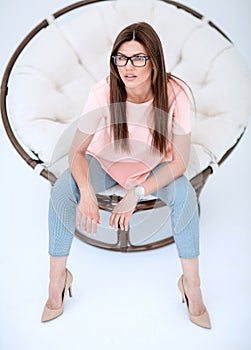 Close up.modern woman sitting in a comfortable chair