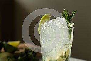 Close-up mojito cocktail at the bar. Mojito cocktail with mint and lime