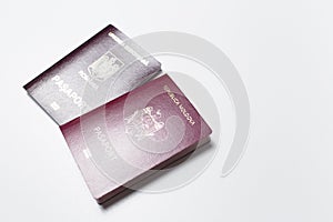 Close-up of Moldavian and Romanian passports isolated on white background.