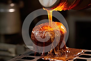 close-up of molten metal being poured into bell mold