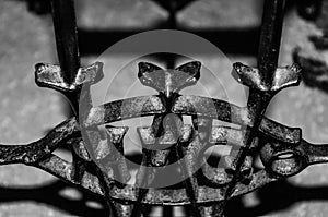 Close-up of a monchrome cast iron design with shadows