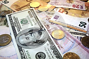 Close-up of money coins and banknotes. Different currencies cash.