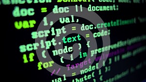 Close up of monitor screen with developing programming and coding technologies. Programmer or hacker is typing code on