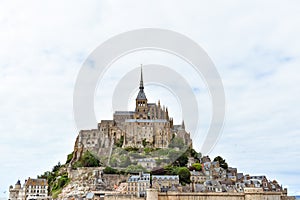 Close-up of Mont Saint Michel, France, in a cloudy sky