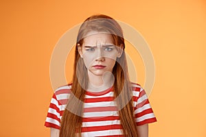 Close-up moody upset childish redhead girl, sulking unfair situation, frowning upset, complaining disappointed, pouting