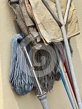 close up mop with fabric on cement wall