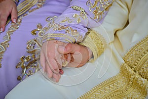 Close up of moroccon couple`s hands at a wedding, photo