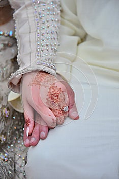 Close up of moroccon couple's hands at a wedding, concept of marriage,