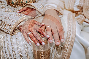 Close up of moroccon couple`s hands at a wedding, photo