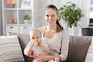 close up of mother with baby drinking water