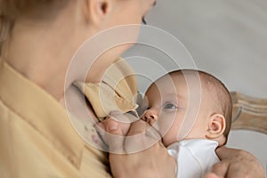 Close up of mother breastfeed baby infant